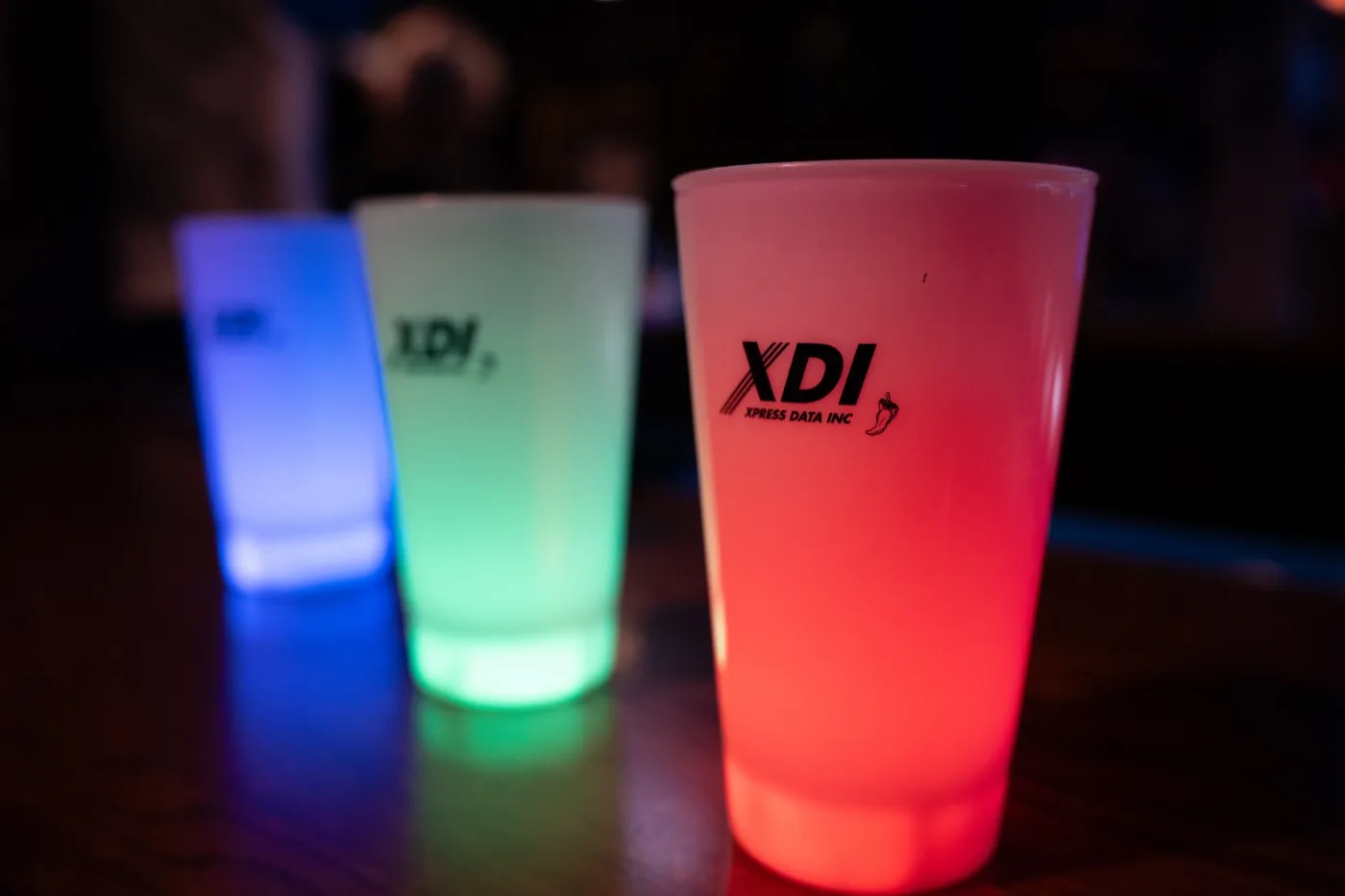 Kansas City event photography - branded light-up cups for the specialty drinks glowing red, green and blue