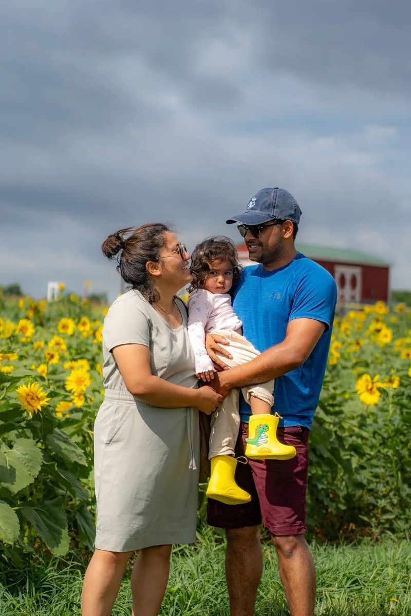 Kansas City family photographer - family with a toddler in a sunflower field