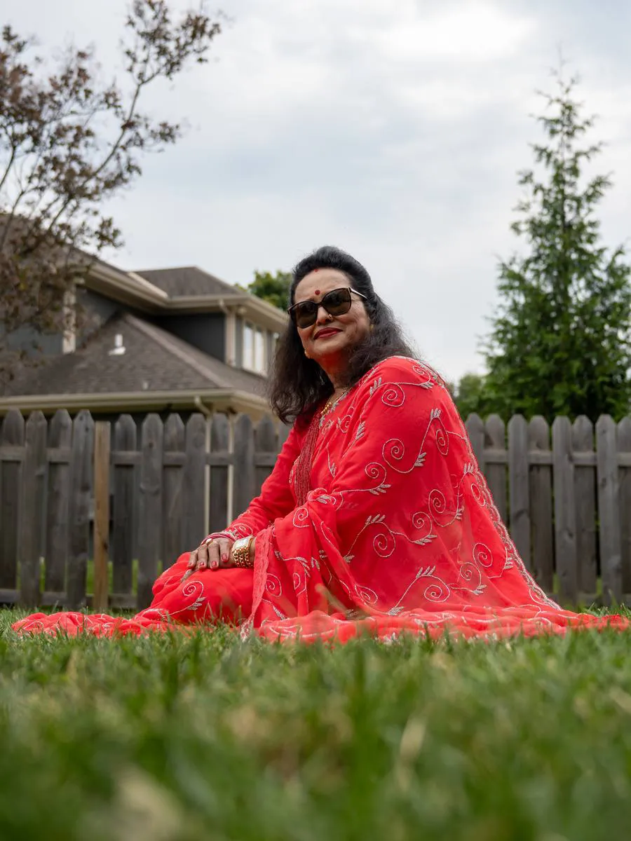 Kansas City portrait photographer - woman in a red saree seated on a lawn